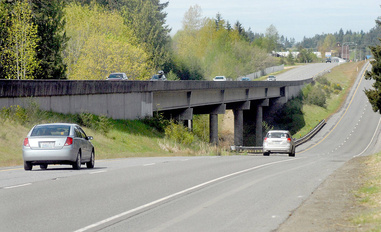 U.S. Highway 101 crosses Siebert Creek east of Port Angeles, with the eastbound lanes using an elevated span while westbound traffic passes over a concrete culvert beneath the roadway. Photo by Keith Thorpe/Olympic Peninsula News Group