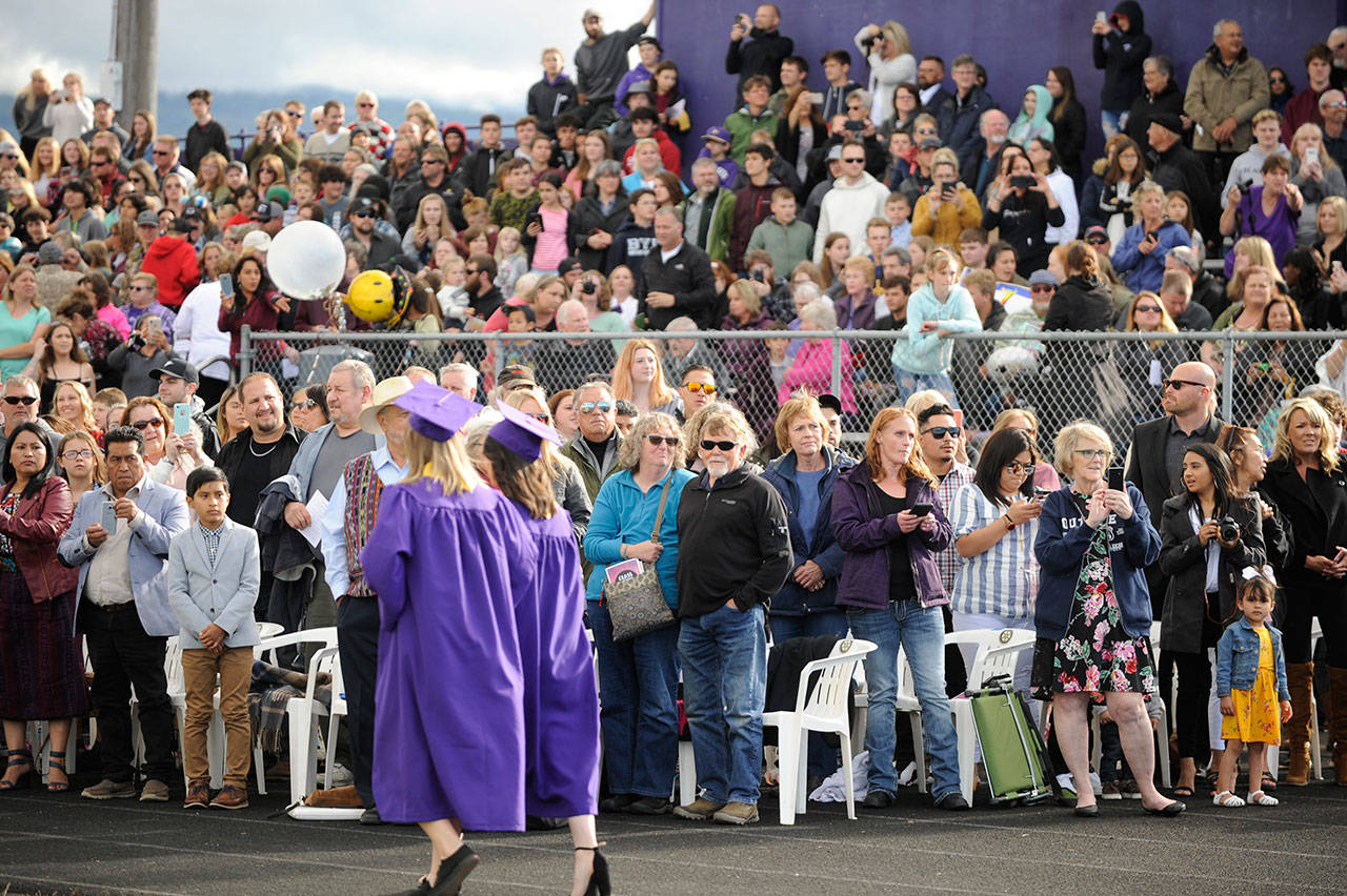 Parents and friends celebrate more than 180 graduating seniors at Sequim High School’s 2019 commencement. With statewide restrictions on large gatherings in place, SHS staff and seniors class officers are looking at a drive-in ceremony for the 2020 event. Sequim Gazette file photo by Michael Dashiell