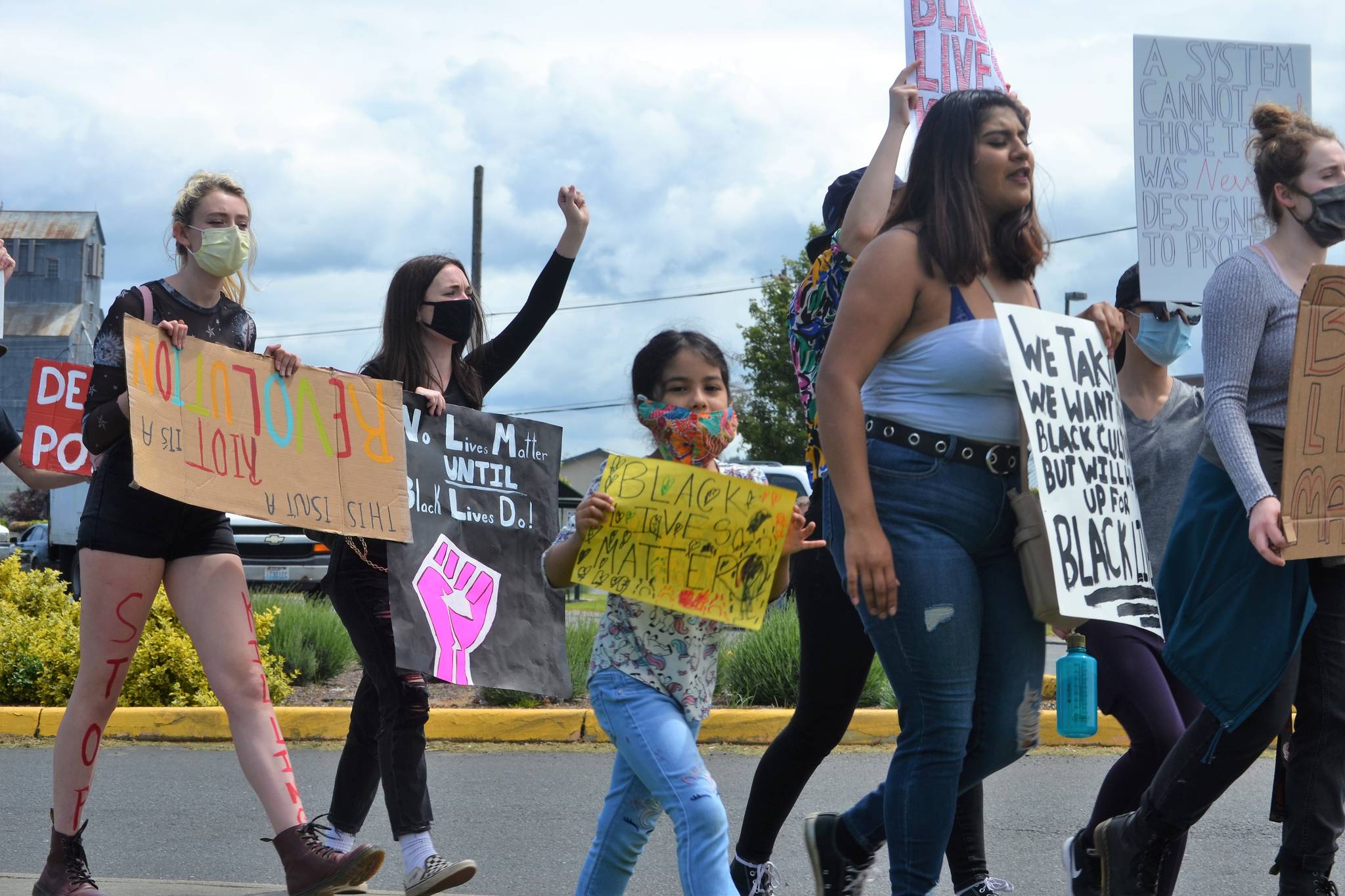 Dulce Maria Villegas, 5, marches with her family during a Black Lives Matter protest on June 4. She was one of about 200 people to march from downtown Sequim to River Road and back. Sequim Gazette photo by Matthew Nash