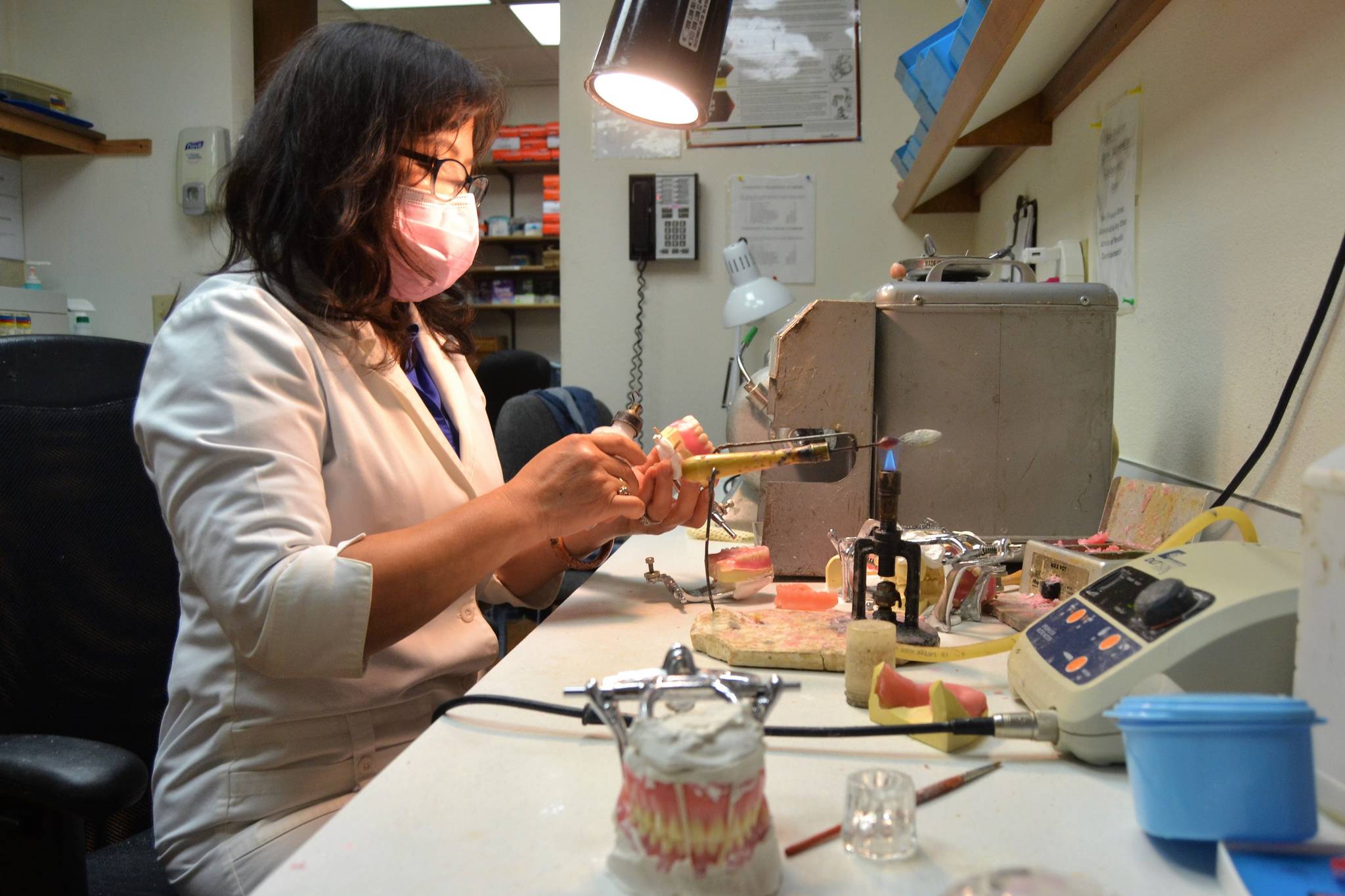Lien Trinh, owner of DentureCare Inc., prepares some dentures for patients at her West Spruce Street business. She’s one of many Sequim businesses slated to receive a business grant from the City of Sequim to help during the pandemic. Sequim Gazette photo by Matthew Nash