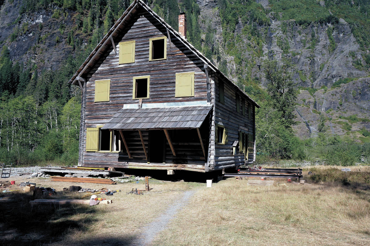 The Enchanted Valley chalet rests on steel beams during work to push the structure back from the banks of the Quinault River in September 2014. Photo courtesy of National Park Service