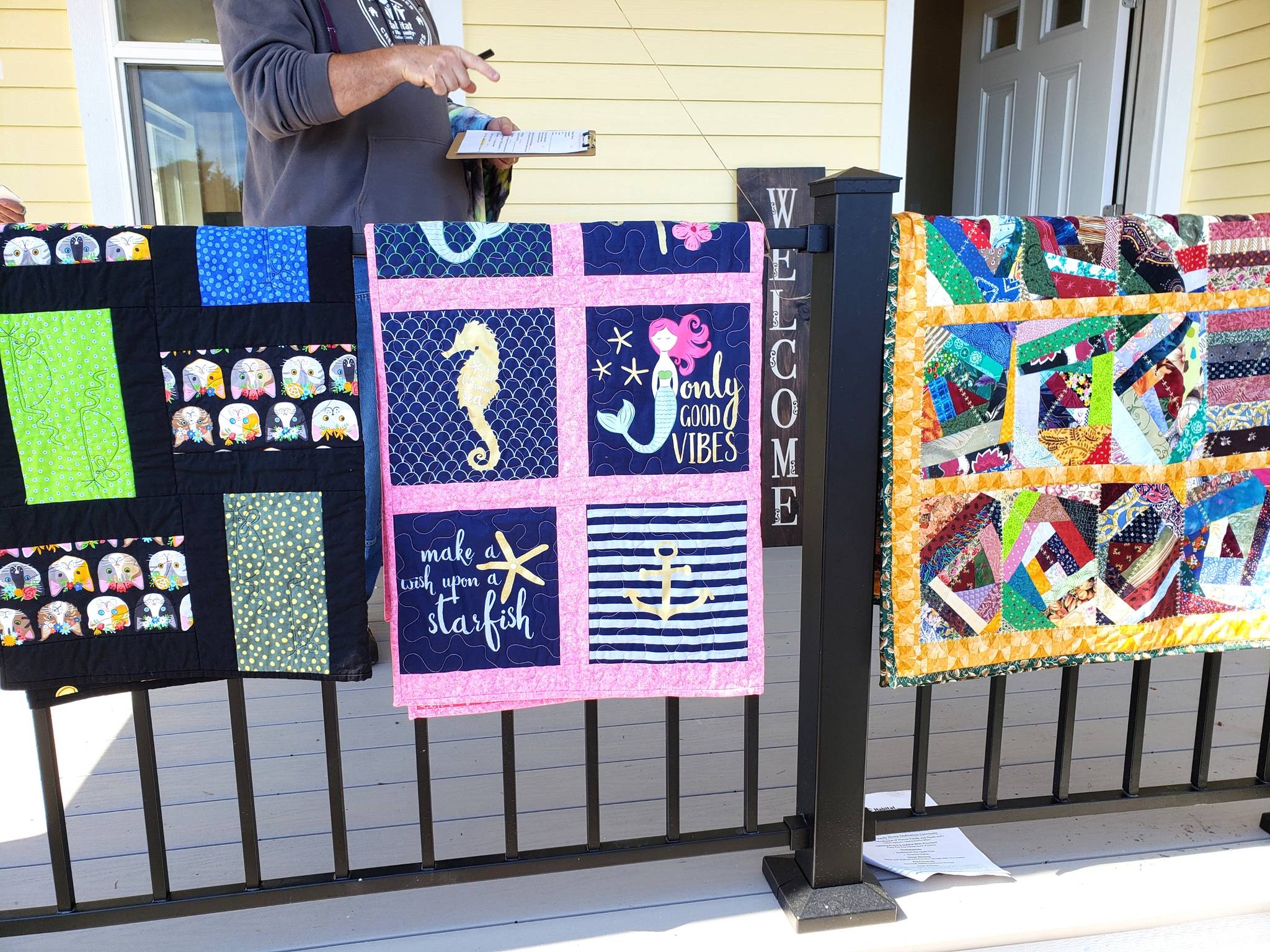 In June, Susan Bermel presented three quilts from the Sunbonnet Sue Quilt Club to family members at their new new home courtesy of Habitat for Humanity of Clallam County. Bermel made the quilts as part of their Community Quilt program with Ilse Osier and Julie Malone. Photo courtesy of Susan Bermel