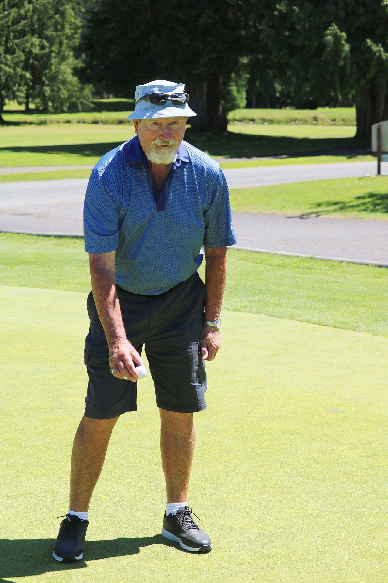 Frank Herodes celebrates a hole-in-one at Sunland Golf & Country Club’s fifth hole on July 15. Submitted photo