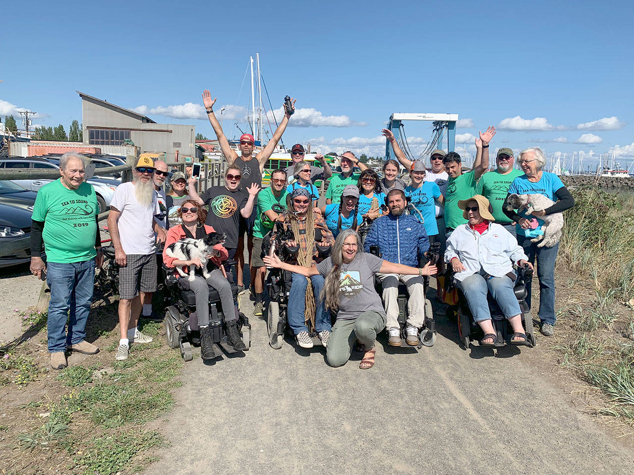 Participants in the first Sea to Sound, a multi-modal ride along the length of the Olympic Discovery Trail, celebrate reaching the end of the Larry Scott Trail in Port Townsend last August. The second annual Sea to Sound will be held Aug. 28-30. Submitted photo