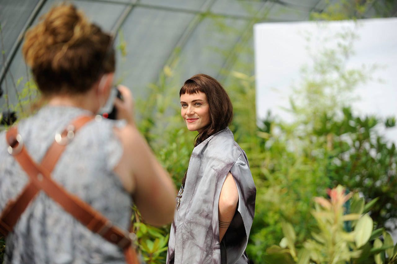 Photographer Cindy Roth snaps shots of Sequim model Aurora Lagattuta for Impact Fashion’s sustainable fashion show in the New Dungeness Nursery. The show debuts at impactfashion.org on Sept. 4. Sequim Gazette photo by Matthew Nash