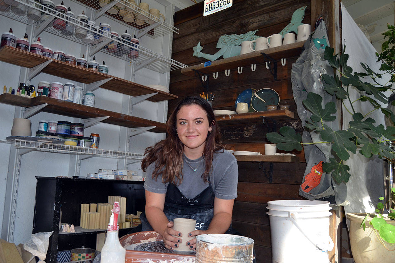Sequim’s Sydney Swanson, 18, recently started up Sunshine Ceramics Studio as an outlet for her to relieve the stresses of the day. To help bring some light to others, she places a few mugs each month along the Olympic Discovery Trail. Sequim Gazette photo by Matthew Nash