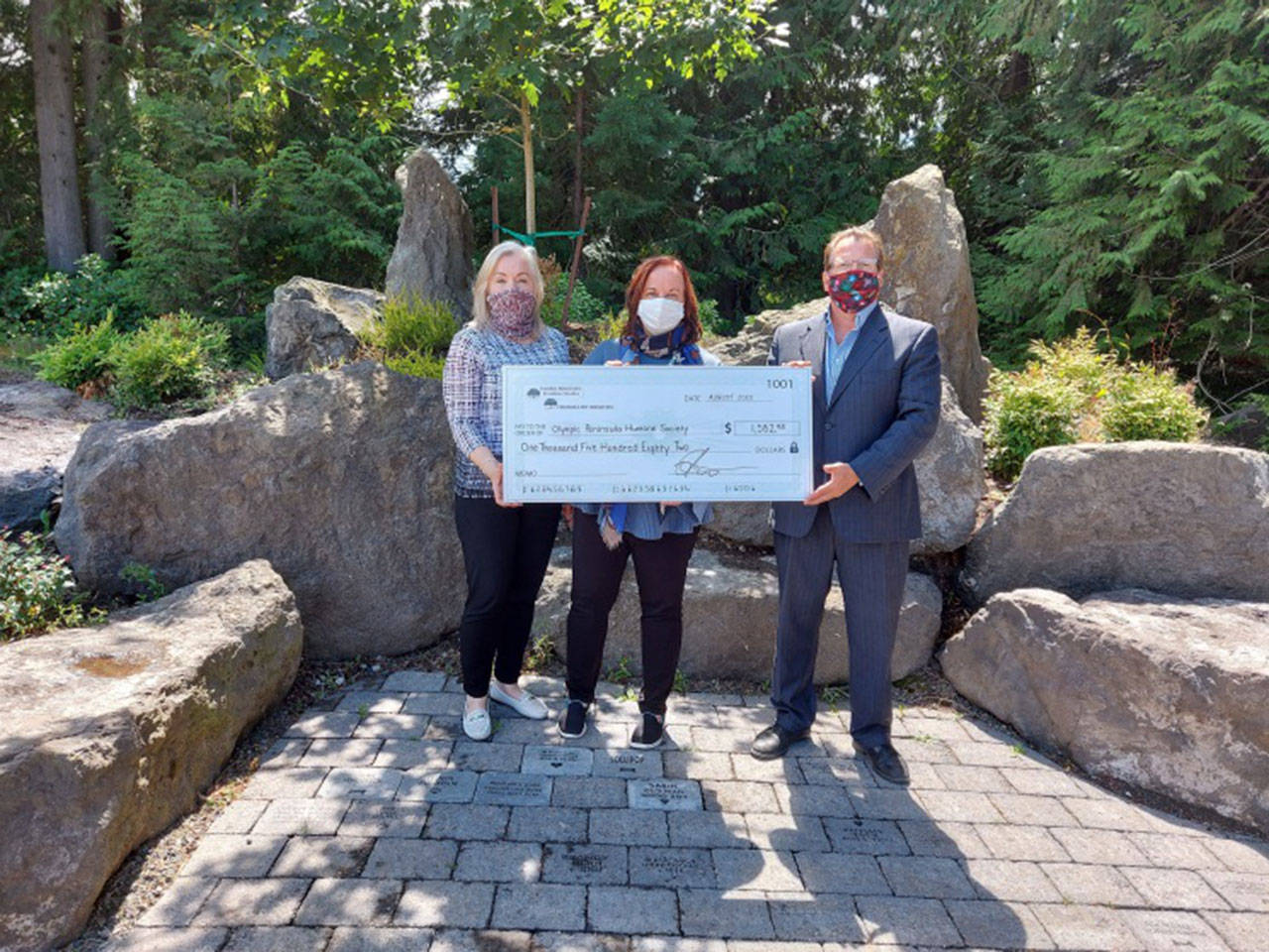 Celebrating a donation from Harper-Ridgeview and Peninsula Pet Cremation to the Olympic Peninsula Humane Society (OPHS) are, from left, OPHS development manager Jaquelene Petersen, OPHS executive director Luanne Hinkle and Mark Gustafson, general manager at Harper-Ridgeview and Peninsula Pet Cremation. Submitted photo