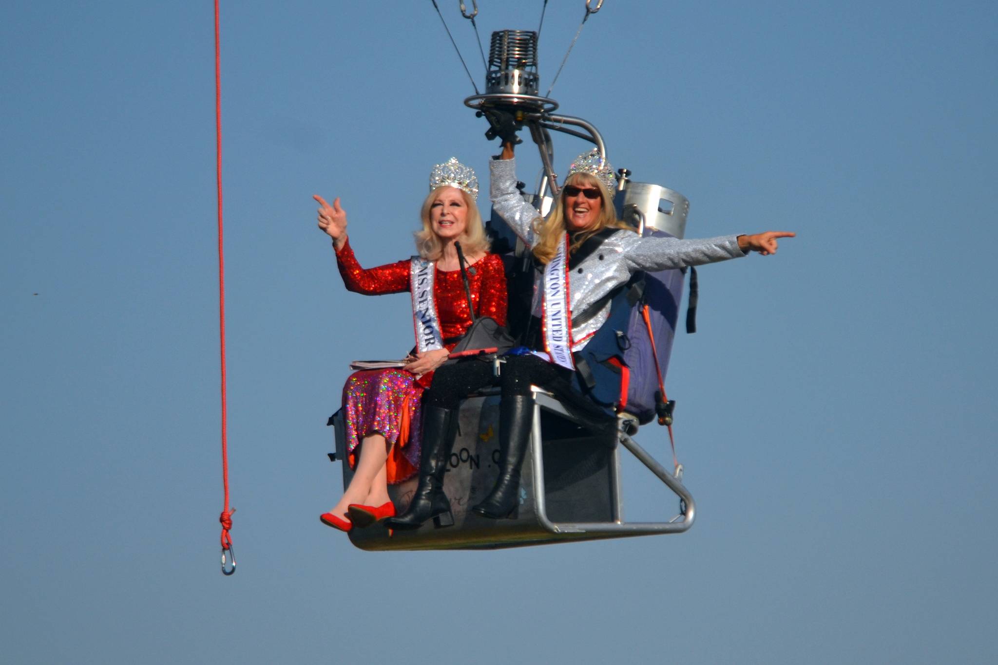 Cherie Kidd, Ms. Senior USA 2019-2020, left, and Captain-Crystal Stout, Ms. Senior Washington USA, film a promotional video from Stout’s Dream Catcher balloon for the Ms. Senior USA pageant in October. This was Kidd’s first time in a balloon on Sept. 9, and next month will be Stout’s first time competing in a pageant. Sequim Gazette photo by Matthew Nash