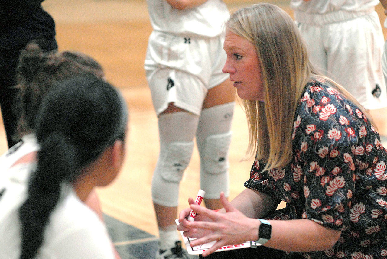 Peninsula College women’s basketball coach Alison Crumb, right, speaks with her players during a game in February 2020. File photo by Keith Thorpe/Olympic Peninsula News Group