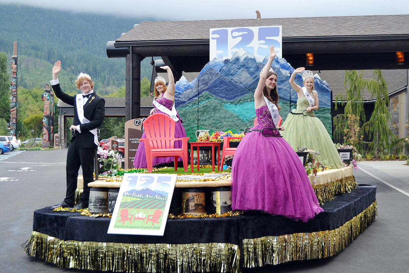 Irrigation Festival Royalty, from left, prince Logan Laxson, princess Brii Hingtgen, princess Alicia Pairadee, and queen Lindsey Coffman wave from their float for the first time on Sept. 19 outside 7 Cedars Casino after COVID-19 concerns led organizers to delay the reveal in March. Sequim Gazette photos by Matthew Nash