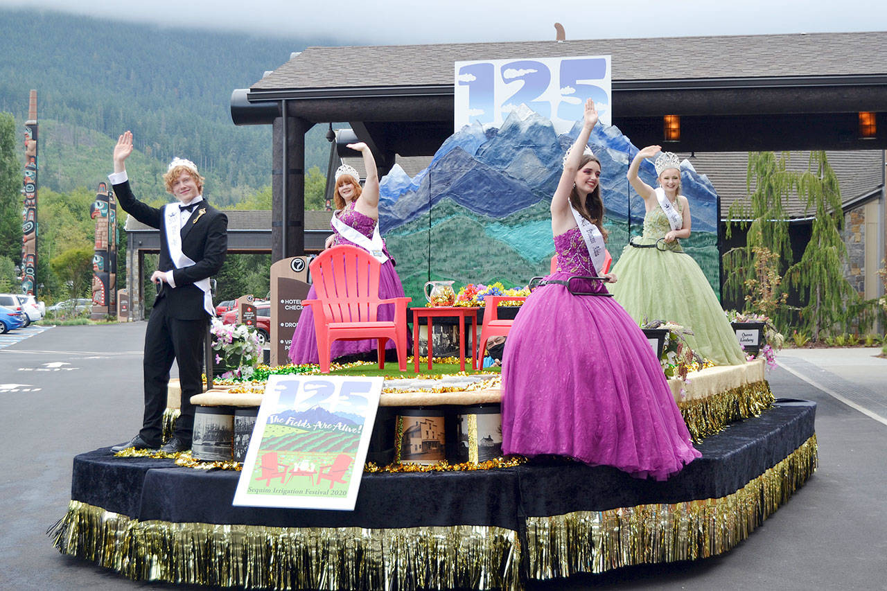 Irrigation Festival Royalty, from left, prince Logan Laxson, princess Brii Hingtgen, princess Alicia Pairadee, and queen Lindsey Coffman wave from their float for the first time on Sept. 19 outside 7 Cedars Casino after COVID-19 concerns led organizers to delay the reveal in March. Sequim Gazette photos by Matthew Nash