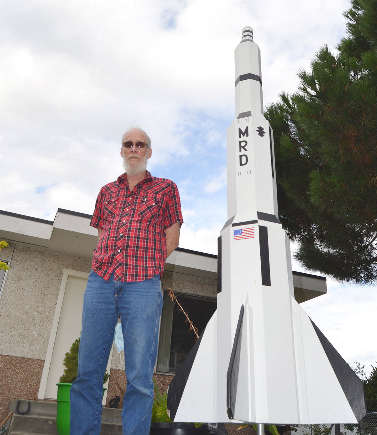 Sequim rocket man shares woodworking project on lawn
