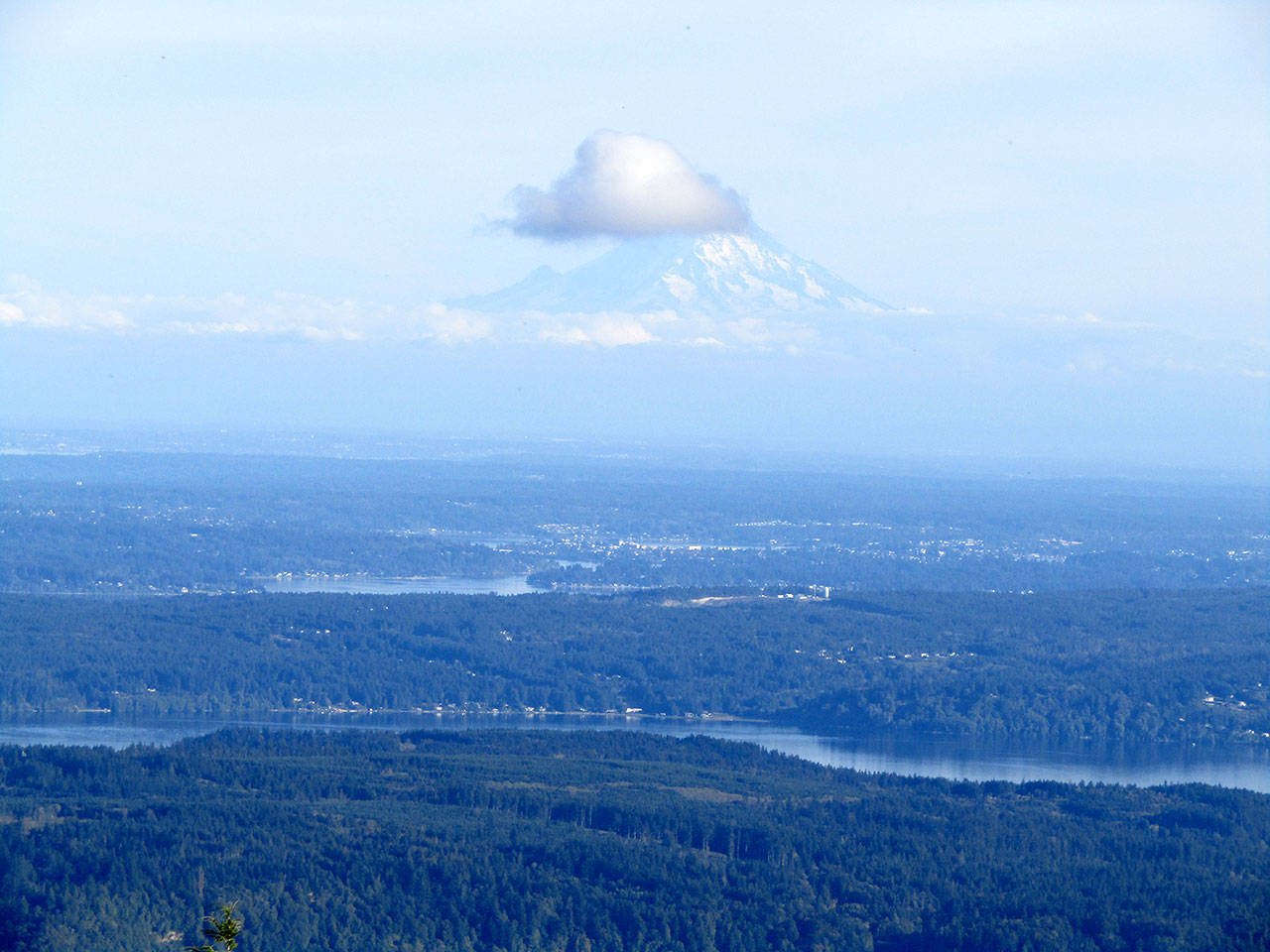 A cloud forms on Mount Rainier. Photo by Rob Ollikainen/Olympic Peninsula News Group