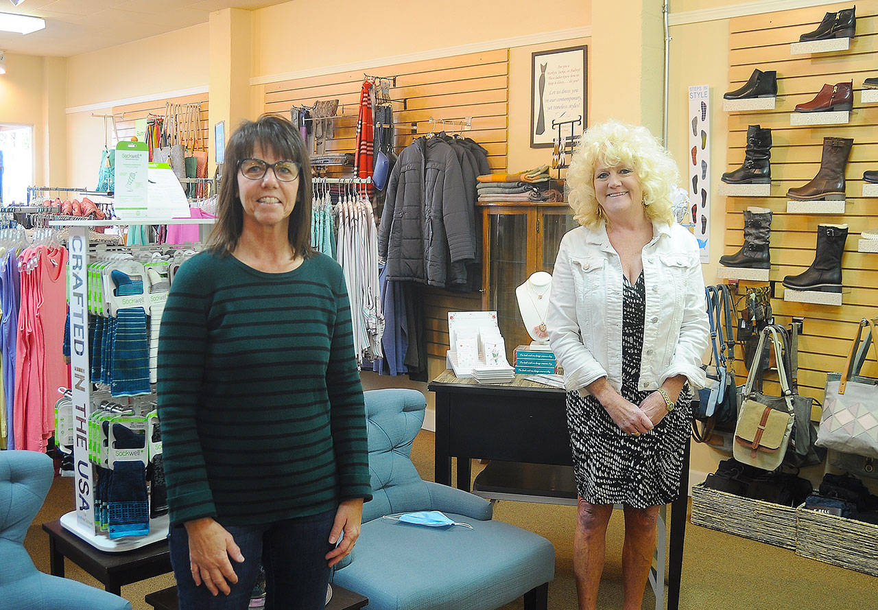 An end of an era, the beginning of a new one of the local business scene: After 20 years at the helm of Solar City Boutique & Retreat, Theresa Rubens (left) recently sold the business to fellow longtime Sequim native Cindy Teitzel. Sequim Gazette photo by Michael Dashiell