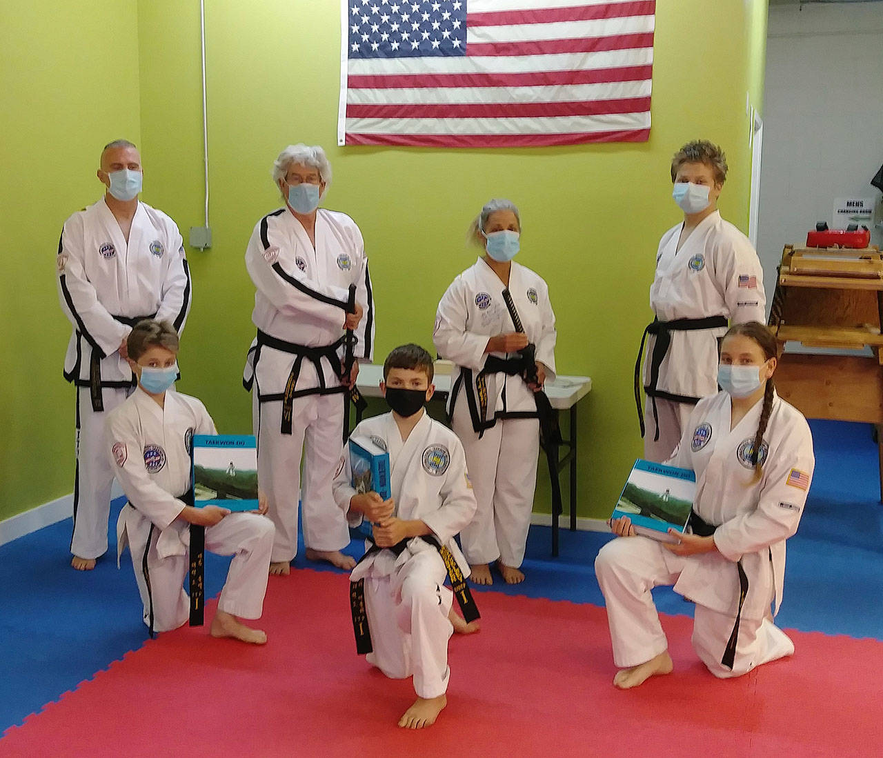 Six Bodystrong Taekwon-do Academy students earned advancements in their black belt studies earlier this month. Pictured are (back row, from left) academy head instructor Brandon Stoppani, Craig Fahrenholtz, Linda Allen and Adrian Golbeck, with (front row) Aron Golbeck, Hunter Muckley and Jessica Golbeck. Submitted photo