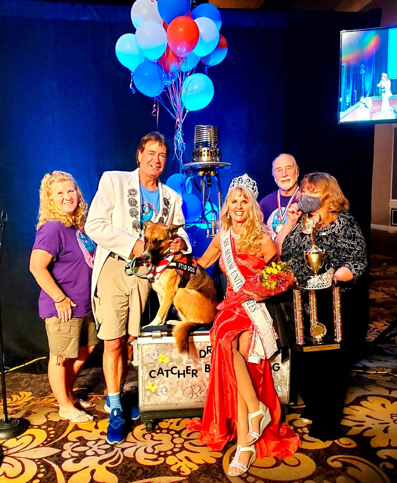 The Dream Catcher Balloon Program team celebrates Captain-Crystal Stout, third from left, winning the Ms. Senior United States title on Oct. 8 in Las Vegas. Included in the picture are, from left, Teresa Stout of Sequim), Brian St. Ours of Sequim, Lucee Light the therapy dog, Crystal Stout, Bob Holt of Sequim, and Ginger Johnson of Las Vegas. Photo courtesy of Captain-Crystal Stout