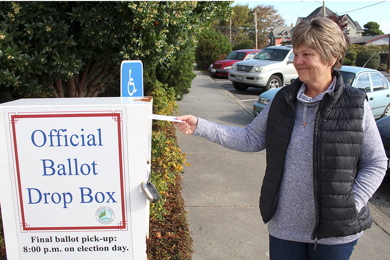 Cindy Rice of Port Ludlow drops off her ballot for the Nov. 3 general election on Thursday at the walk-up drop box in front of the Jefferson County Courthouse, 1820 Jefferson St. (Zach Jablonski/Peninsula Daily News)