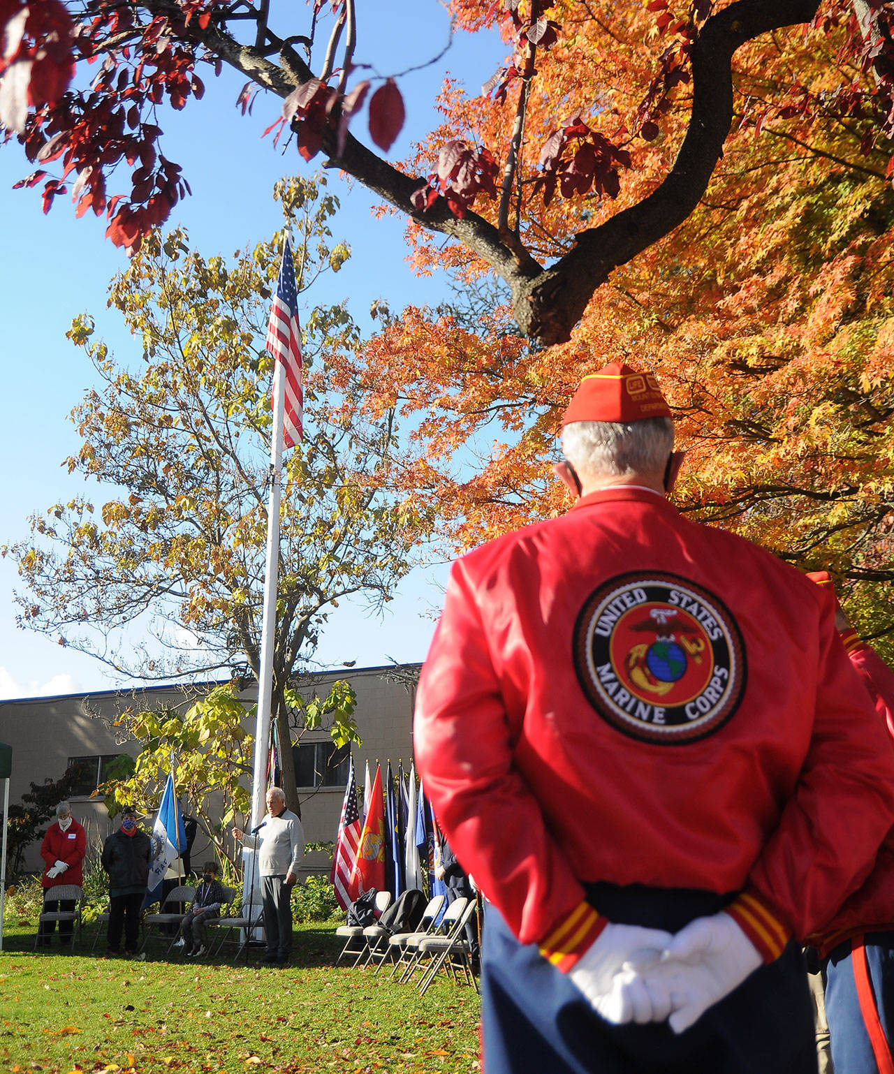 Members of the Marine Corp League’s Mt. Olympus Detachment listen as Tom Ferrell, veteran and City of Sequim deputy mayor, addresses a Veterans Day ceremony crowd.