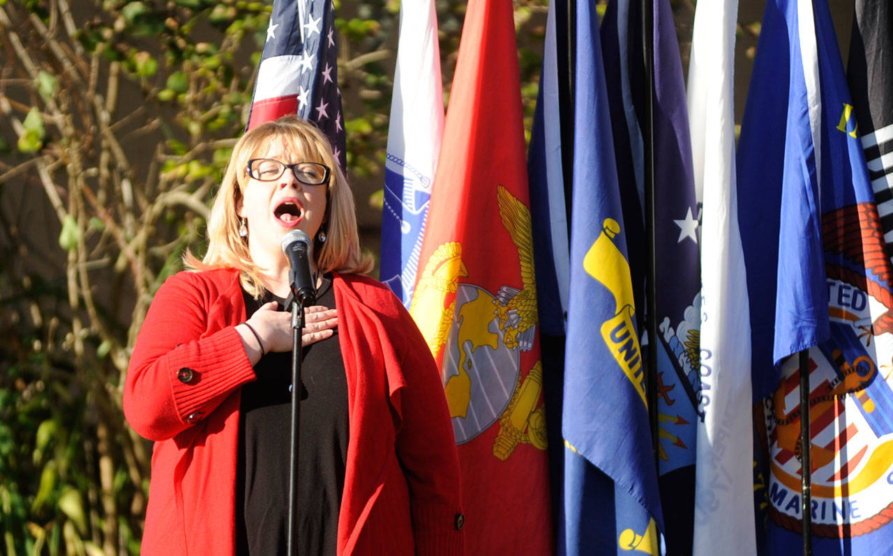 Amanda Bacon leads the National Anthem as part of the Nov. 11 Veterans Day event at Pioneer Memorial Park on Nov. 11. Sequim Gazette photo by Michael Dashiell