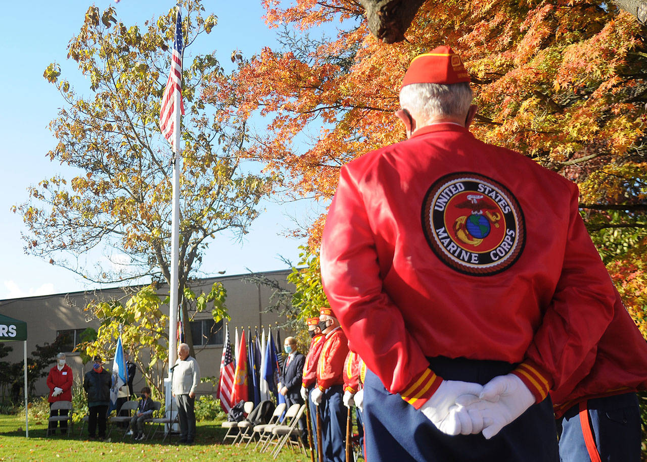 Members of the Marine Corp League’s Mt. Olympus Detachment listen as Tom Ferrell, veteran and City of Sequim deputy mayor, addresses a Veterans Day ceremony crowd at Pioneer Memorial Park on Nov. 11. Sequim Gazette photo by Michael Dashiell