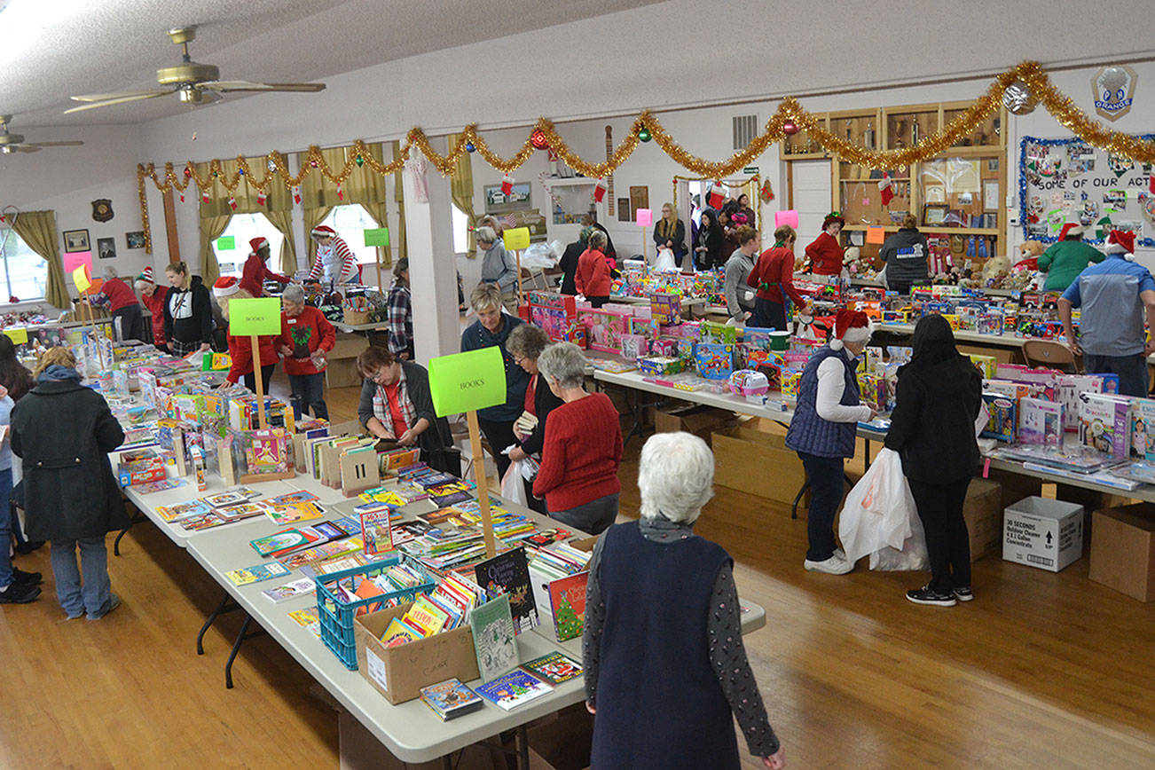 Toys for Sequim Kids continues this year on Dec. 9 at the Sequim Prairie Grange, with masks required for volunteers and families. Toy and donation sites are setup at several Sequim locations. Last year, the event provided 411 children from 140 families in the Sequim area. Sequim Gazette file photo by Matthew Nash