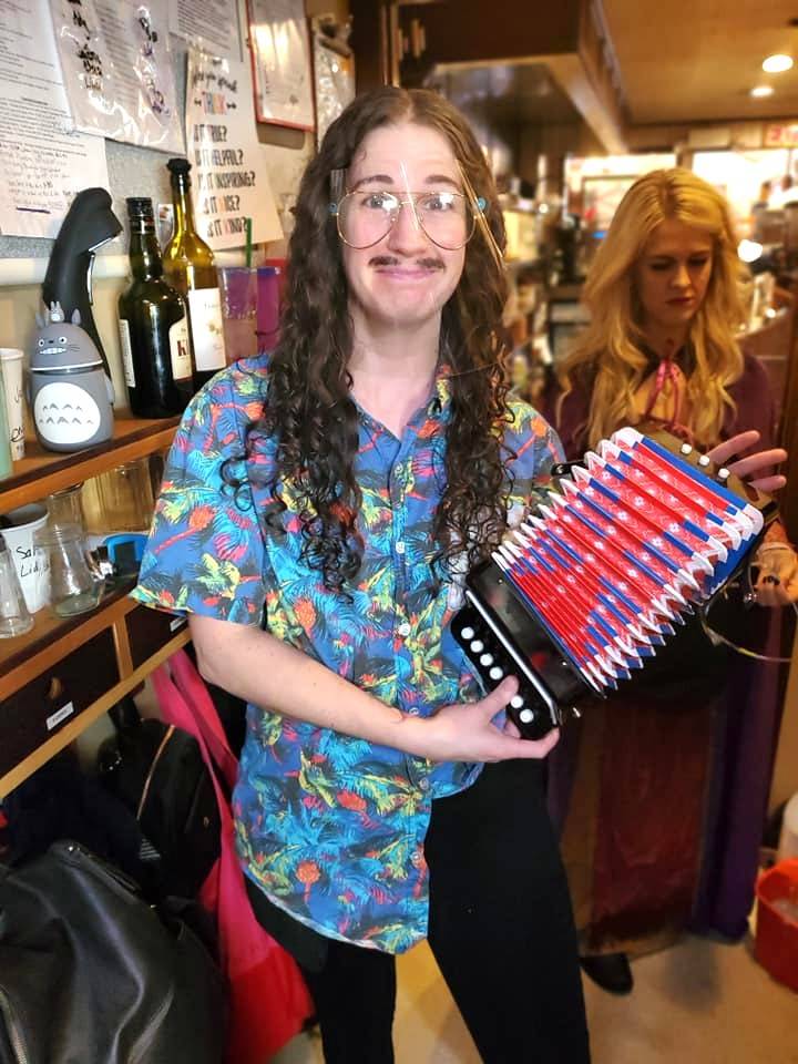 Sara Brabant dresses as “Weird Al” Yankovic for Halloween saying “my hair was just right.” She reminds us all to have fun as we can in these weird times. Photo courtesy of Oak Table Cafe