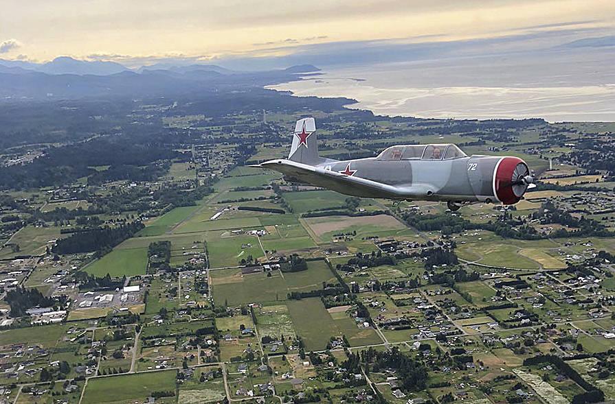 Daniel Sallee flies a Nanchang aircraft above Sequim in 2018. Photo courtesy of Andy Sallee/Sequim Valley Airport