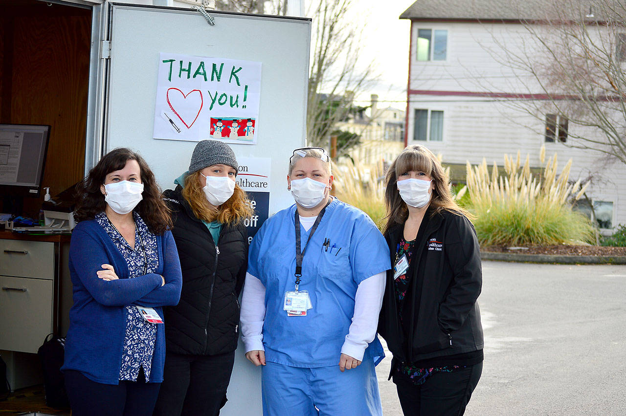 Working the COVID vaccination drive-up station on Dec. 17 are, from left, Jefferson Healthcare staffers Jaimie Hoobler, Brandy Boyd, Jess Cigalotti and Lori Banks. Photo by Diane Urbani de la Paz/Olympic Peninsula News Group
