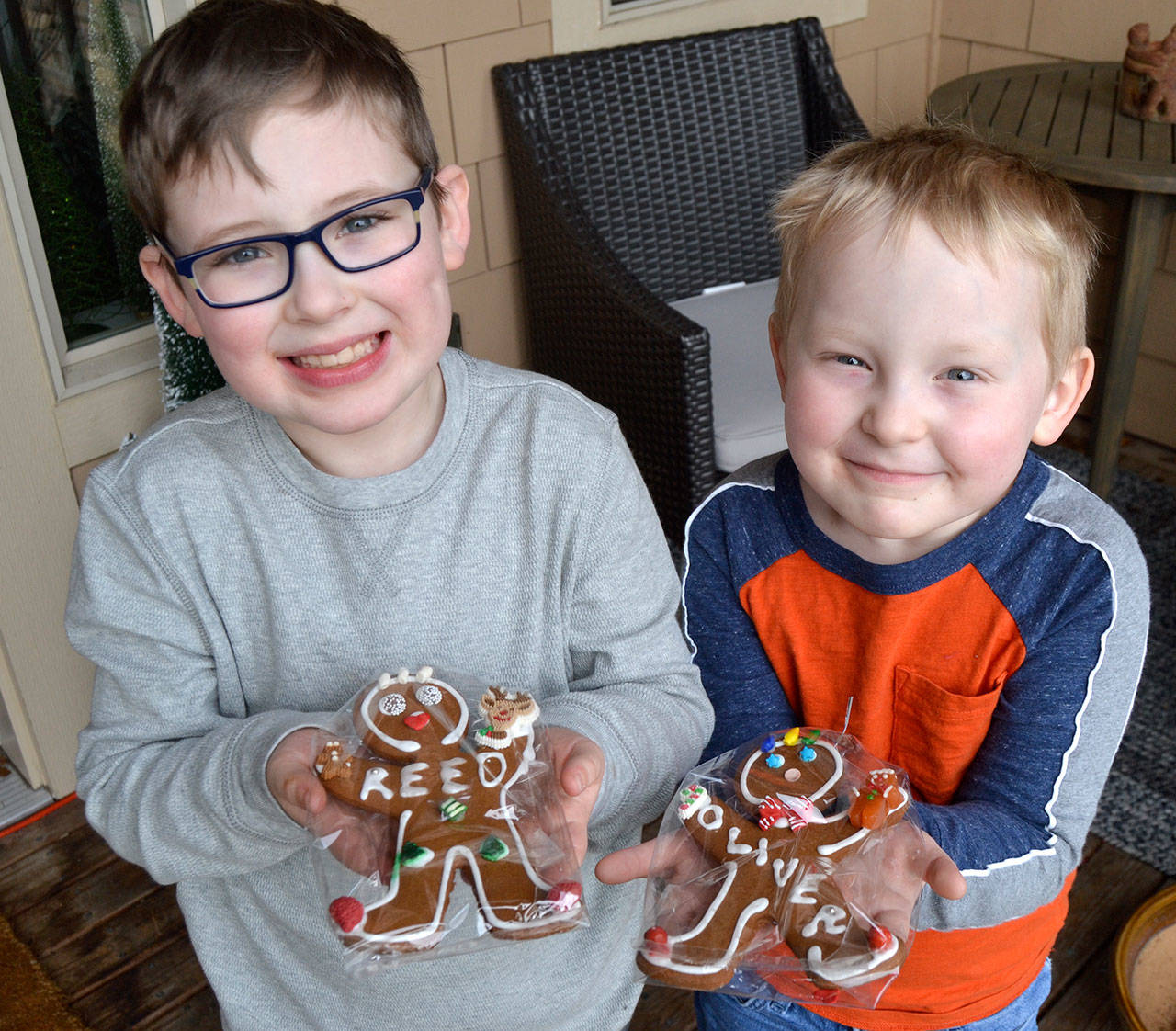 Reporter Matthew Nash’s boys ready to enjoy some gingerbread cookies made and personalized by neighbors for Christmas. Sequim Gazette photo by Matthew Nash