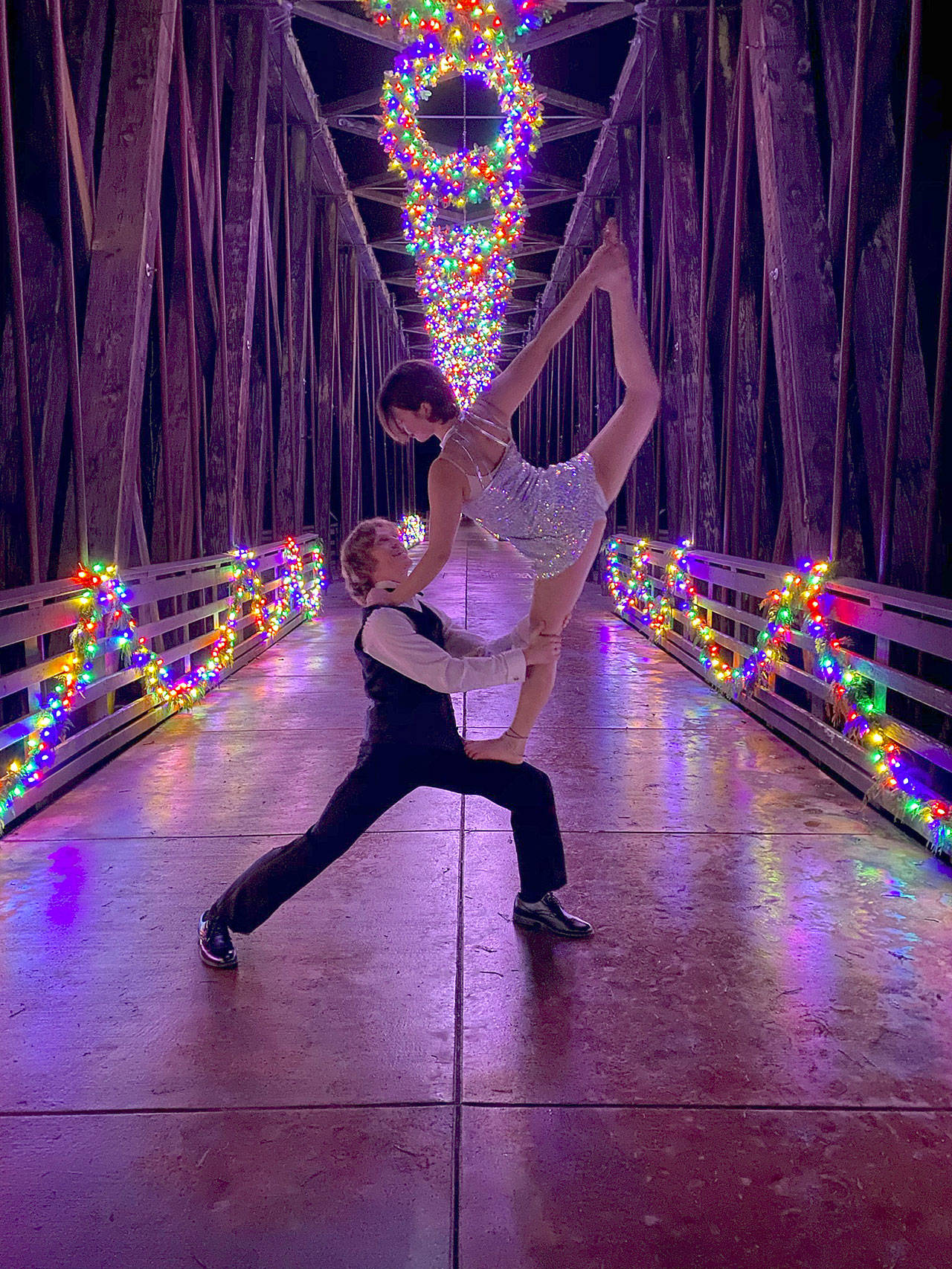 Logan Laxson and Mia Underwood move their Sequim Acrobatics rehearsals outdoors, using the Dungeness Railroad Bridge as a stage for a Dec. 19 photo shoot. Submitted photo