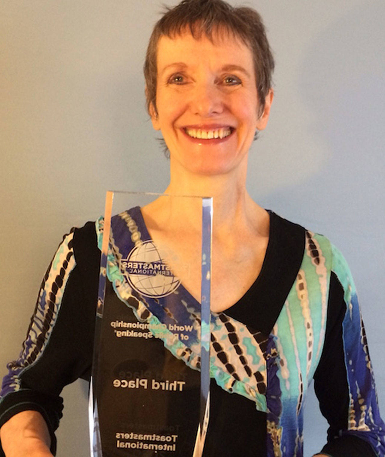 Lindy MacLaine, pictured here with her third place trophy from the 2020 Virtual World Championship of Public Speaking, invites the community to the next Skwim Toastmasters virtual meeting set for Tuesday, Jan. 5. Submitted photo