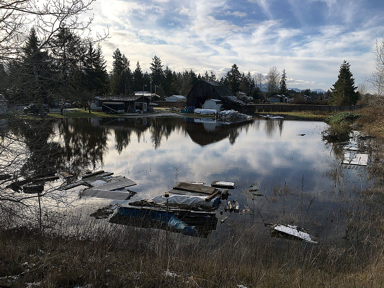 Portions of Seventh Avenue, including the 900 block of South Seventh Avenue, saw flooding from heavy rains, blocked storm drains and/or flooded stormwater ponds on Dec. 21. Sequim Gazette photo by Matthew Nash