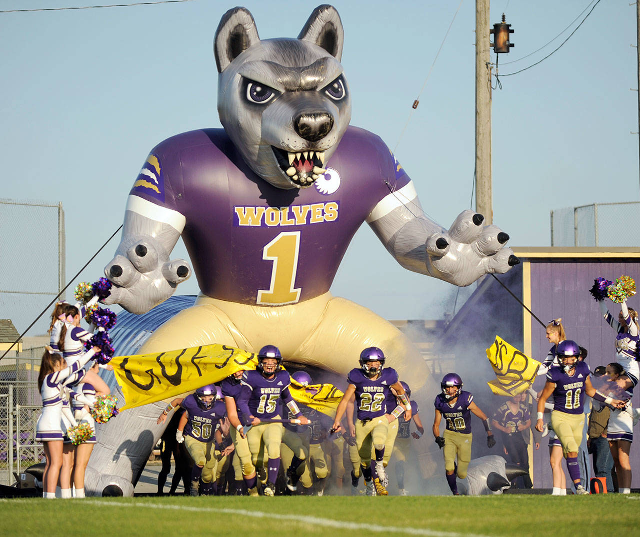 Sequim football players run out of the tunnel before their 2019 season opener against Washington last September. Sequim Gazette file photo by Michael Dashiell