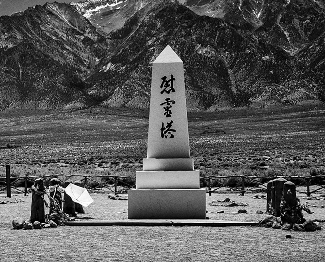 Brian Goodman’s photo ”Soul Consoling Tower, Cemetery, and the Sierra Nevada” (2015), details one of the few remaining structures left after the Manzanar internment camp was dismantled, sold off and bulldozed. The obelisk monument in the camps cemetery was designed and built by incarceree stonemason Ryozo Kado and is inscribed with Japanese characters which translate to “Soul Consoling Tower.” Photo by Brian Goodman