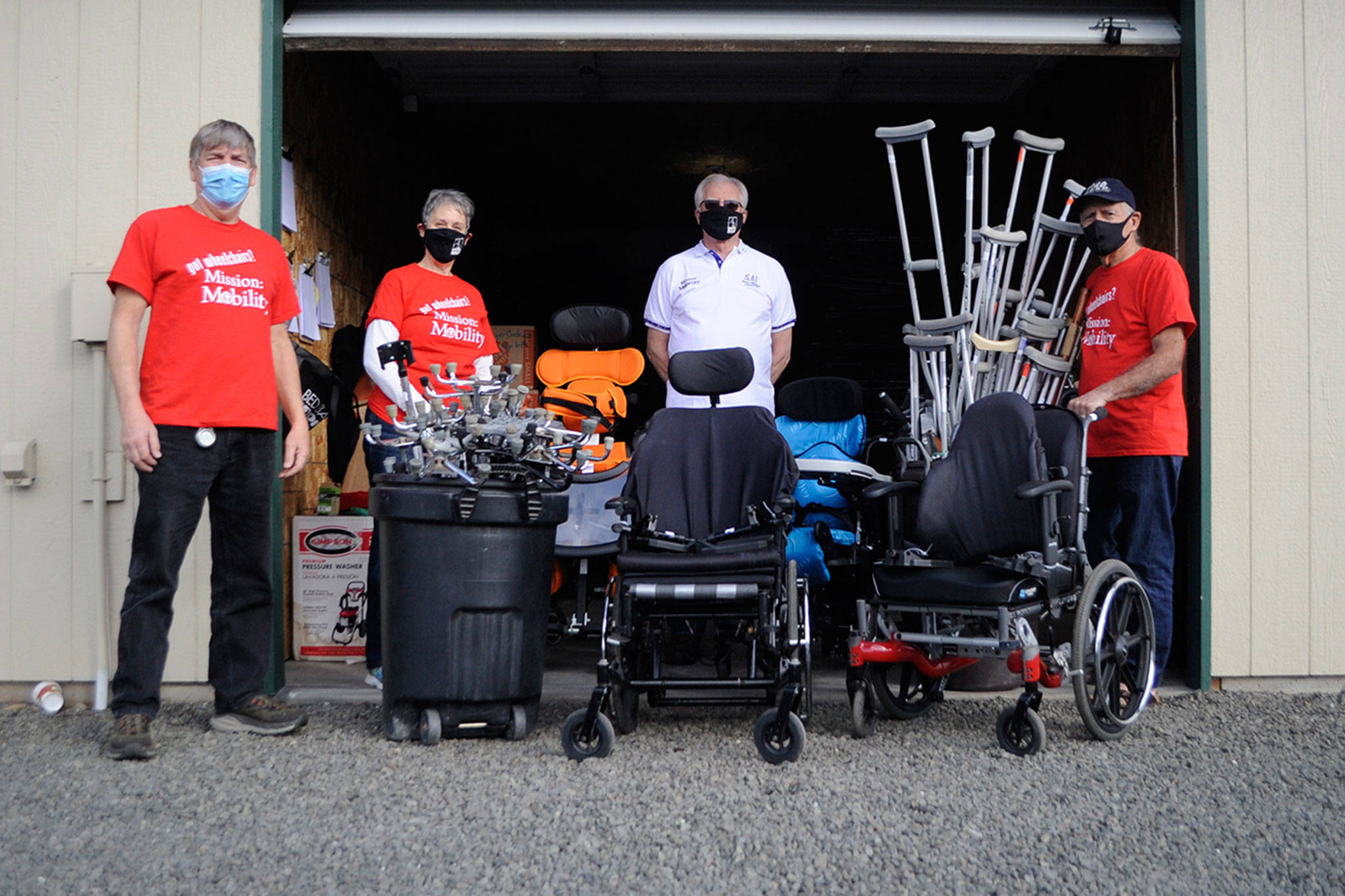 Volunteers at Dungeness Community Church, from left, Al Chrisman, organizer Rosalie DiMaggio, Martin Murray and Jim Coley seek donated wheelchairs, walkers, canes and more to ship to Guatemala as part of their church’s effort to support people in Chimaltenango gain mobility. Sequim Gazette photo by Matthew Nash
