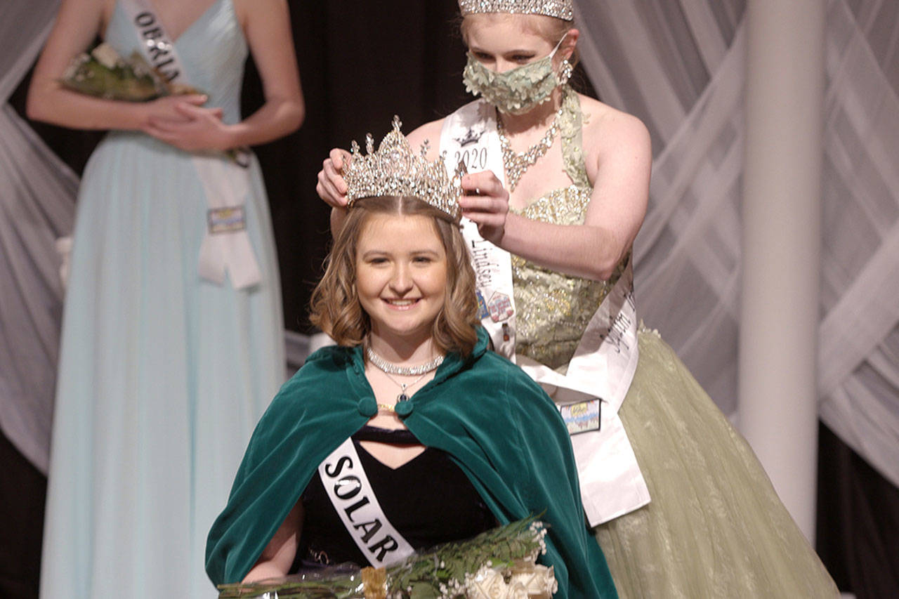 Last year’s queen Lindsey Coffman crowns the newest Sequim Irrigation Festival queen Hannah Hampton in a virtual royalty pageant on Feb. 27. Photo courtesy of Silas Crews
