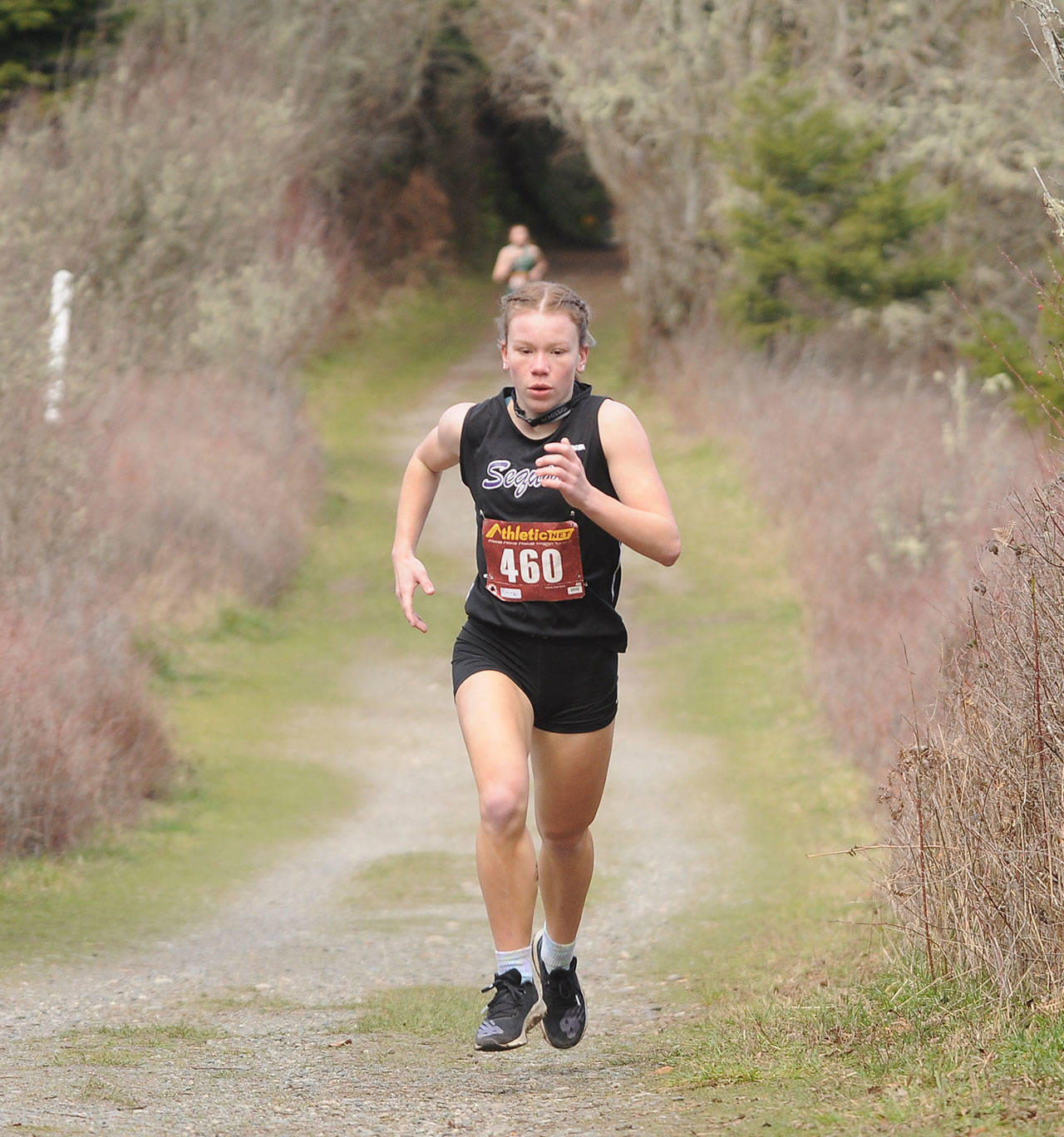 Sequim junior Riley Pyeatt breaks out to a big lead as she helps the Wolves with a one-point win over Klahowya at Voice of America Park on March 6, Sequim’s lone home meet of the abbreviated 2021 season. Sequim Gazette photo by Michael Dashiell