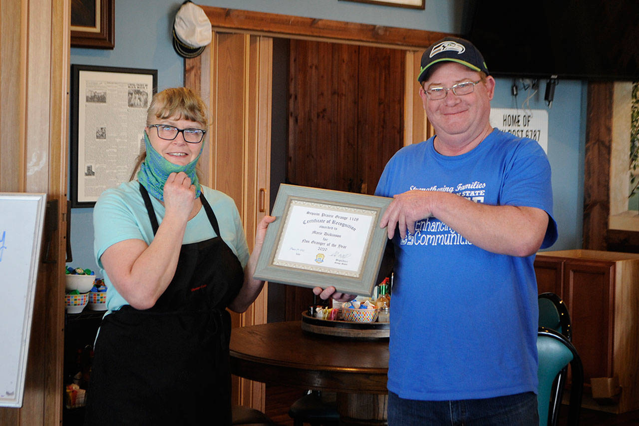 Marie Dickinson, owner of the Mariner Café, was named the “Non-Granger of the Year” for her support of the community and the Sequim Prairie Grange in 2020. On March 16, David McDaniels, master of the Sequim Prairie Grange, presented the award to Dickinson at her café. Sequim Gazette photo by Matthew Nash