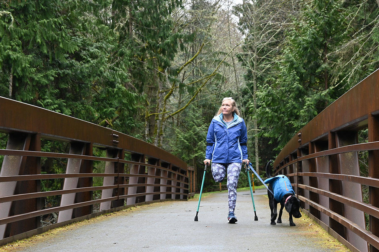 Dana Lawson and Stella enjoy a trek on the Olympic Discovery Trail in late March. Lawson, a Port Angeles resident, is training to participate in the North Olympic Discovery Marathon between Sequim and Port Angeles this June. Sequim Gazette photo by Michael Dashiell