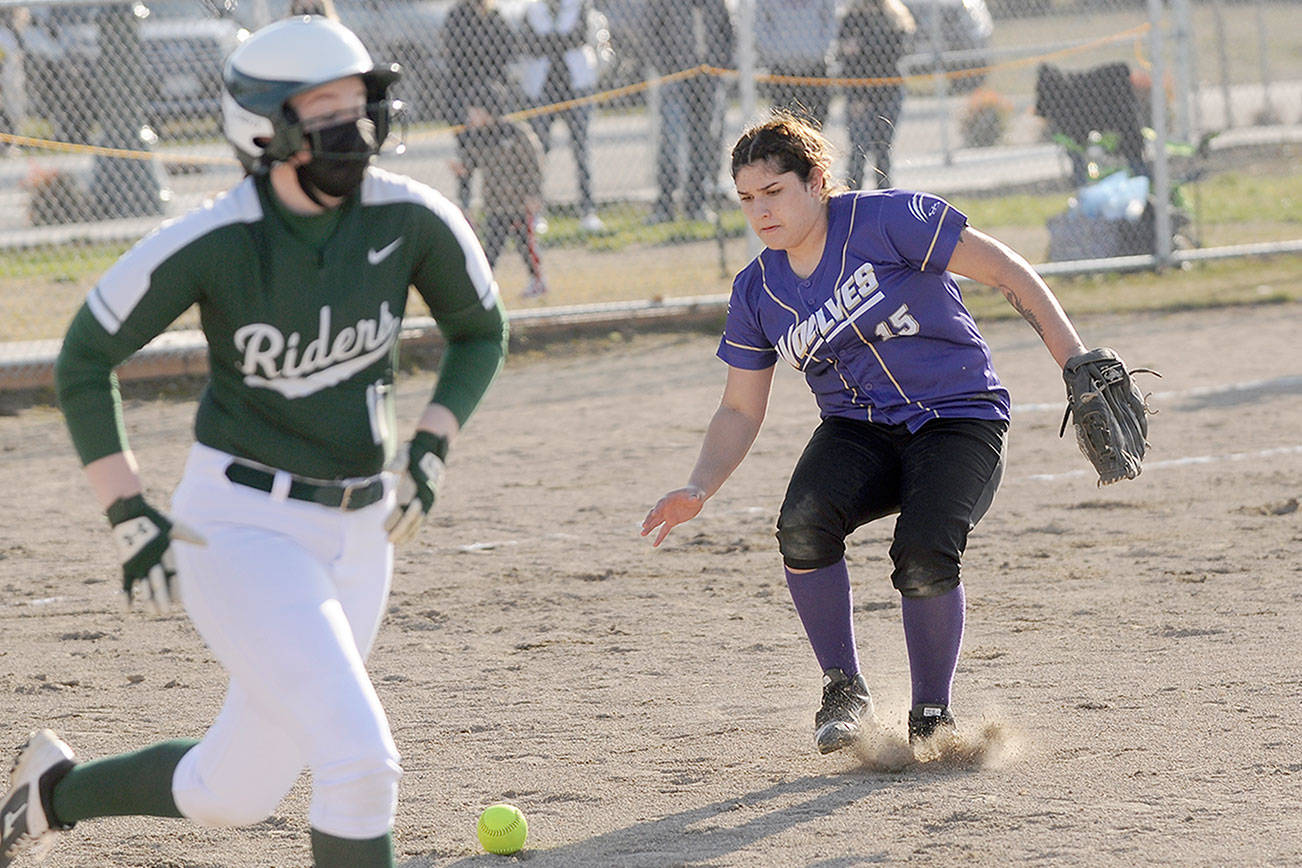 Michael Dashiell/Olympic Peninsula News Group
Sequim third baseman Kailin Lopez makes a play to throw out Port Angeles' Taylor Worthington in the fifth inning of PA's 11-6 win over Sequim on March 30.