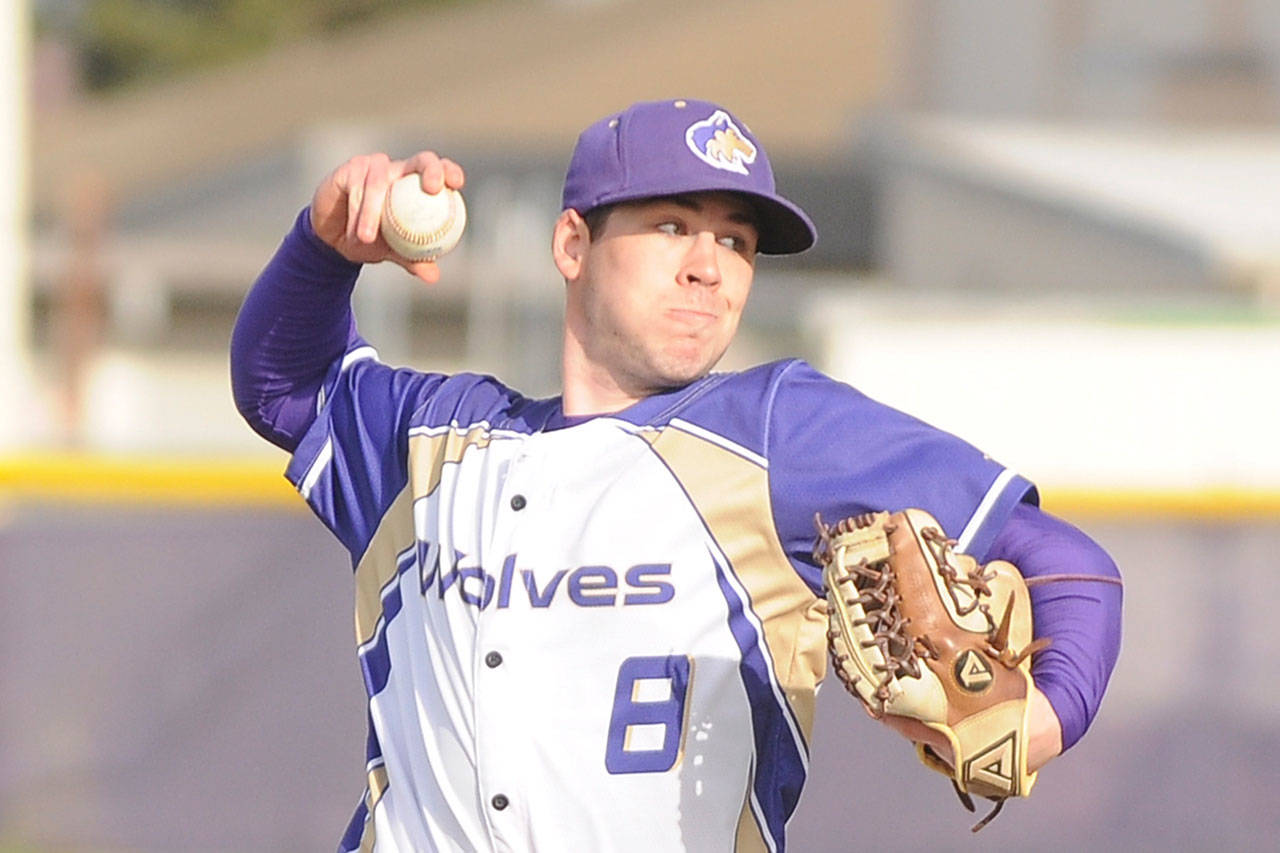 Sequim’s Michael Grubb works in relief as the Wolves take on Bainbridge Island on April 6. Sequim Gazette photo by Michael Dashiell