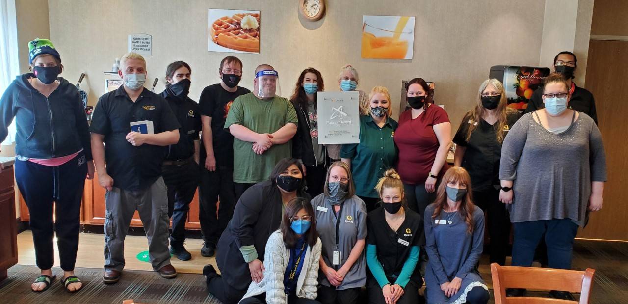 Staff with the Quality Inn & Suites at the Olympic National Park gather to commemorate receiving the Platinum Award for being among their franchise’s top 3 percent in customer satisfaction. Submitted photo