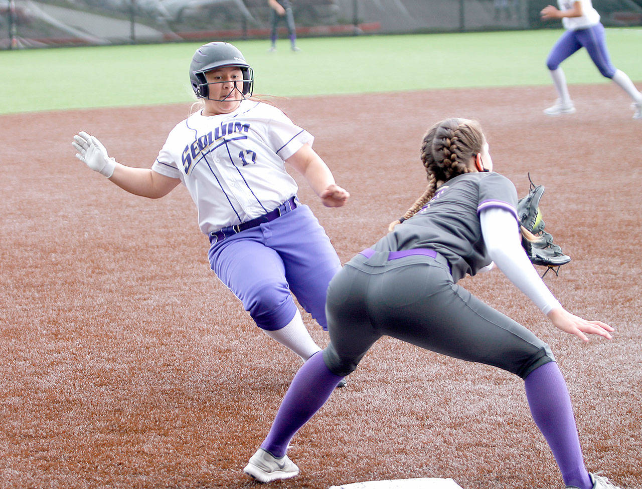 Sequim’s Lily Fili slides into third base against North Kitsap at the Olympic League tournament in Silverdale on May 1. North Kitsap edged the Wolves, 2-1. Photo by Mark Krulish/Kitsap News Group