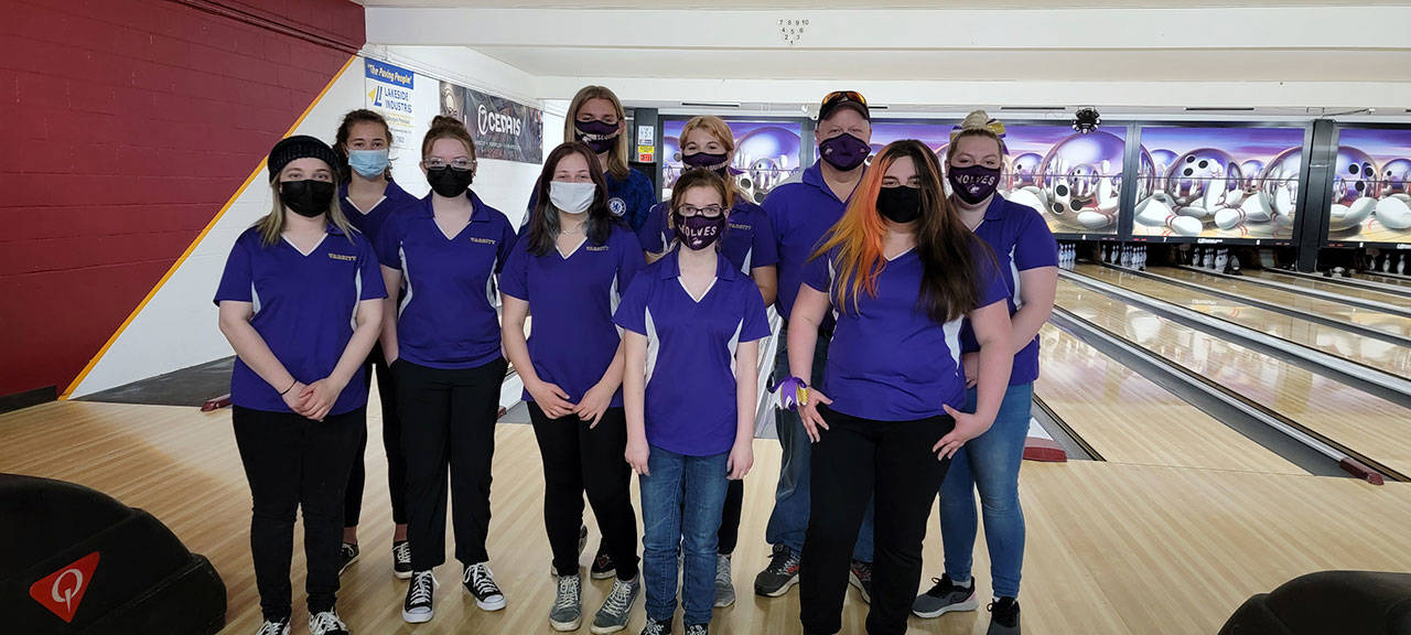Sequim High’s bowling squad takes a break from competition at Laurel Lanes in Port Angeles, at their May 11 match versus Bremerton. Photo courtesy of Randy Perry