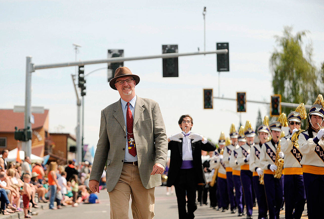 Vern Fosket, Sequim High School band director, enjoys a sunny Sequim Irrigation Festival Grand Parade in 2015. Fosket stepped down from his band director role this year. Sequim Gazette file photo by Michael Dashiell