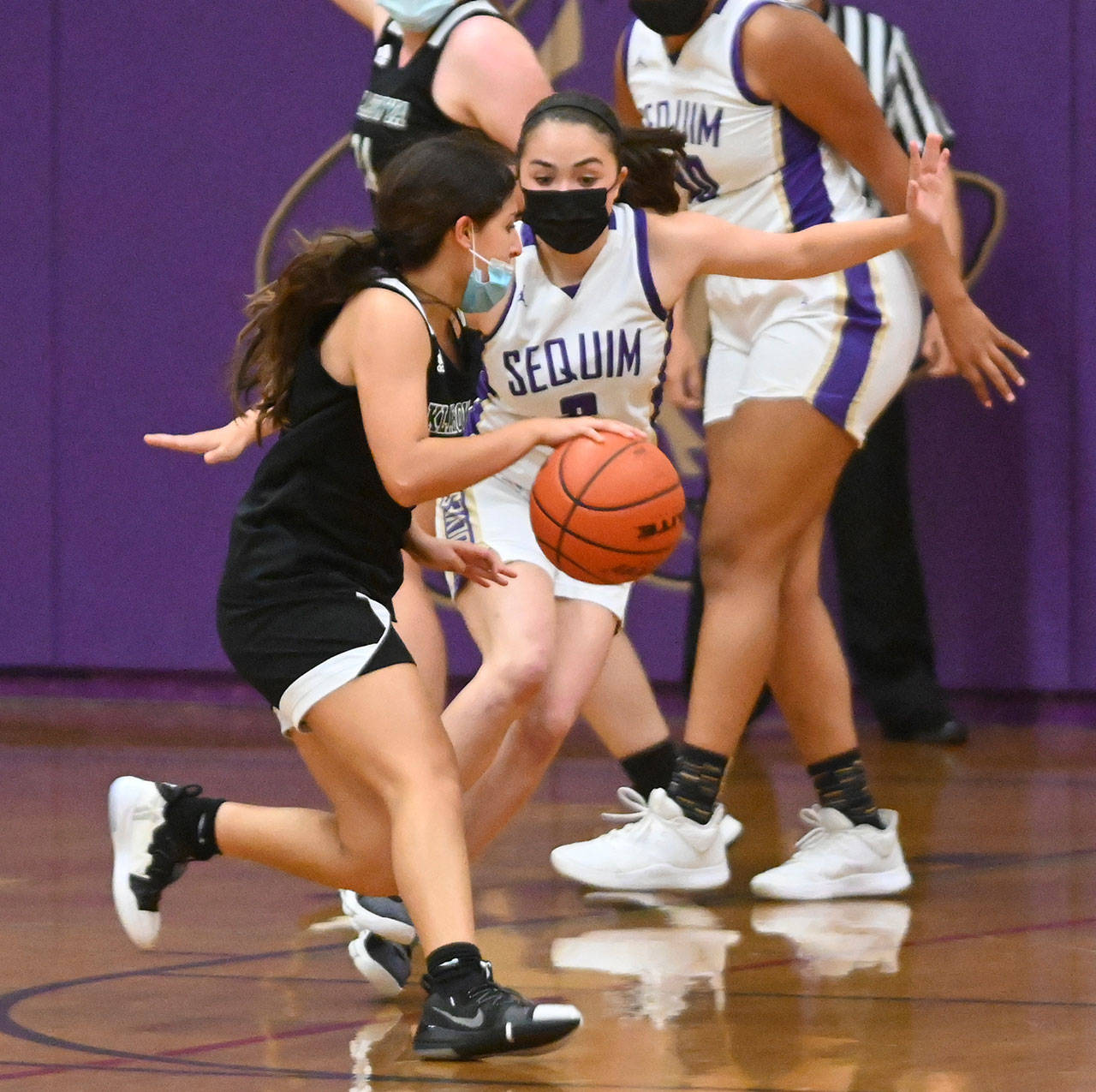 Sequim’s Hannah Bates guards Klahowya’s Sahara Soufie in the first half of the Wolves’ 68-8 home victory on May 25. Sequim Gazette photo by Michael Dashiell