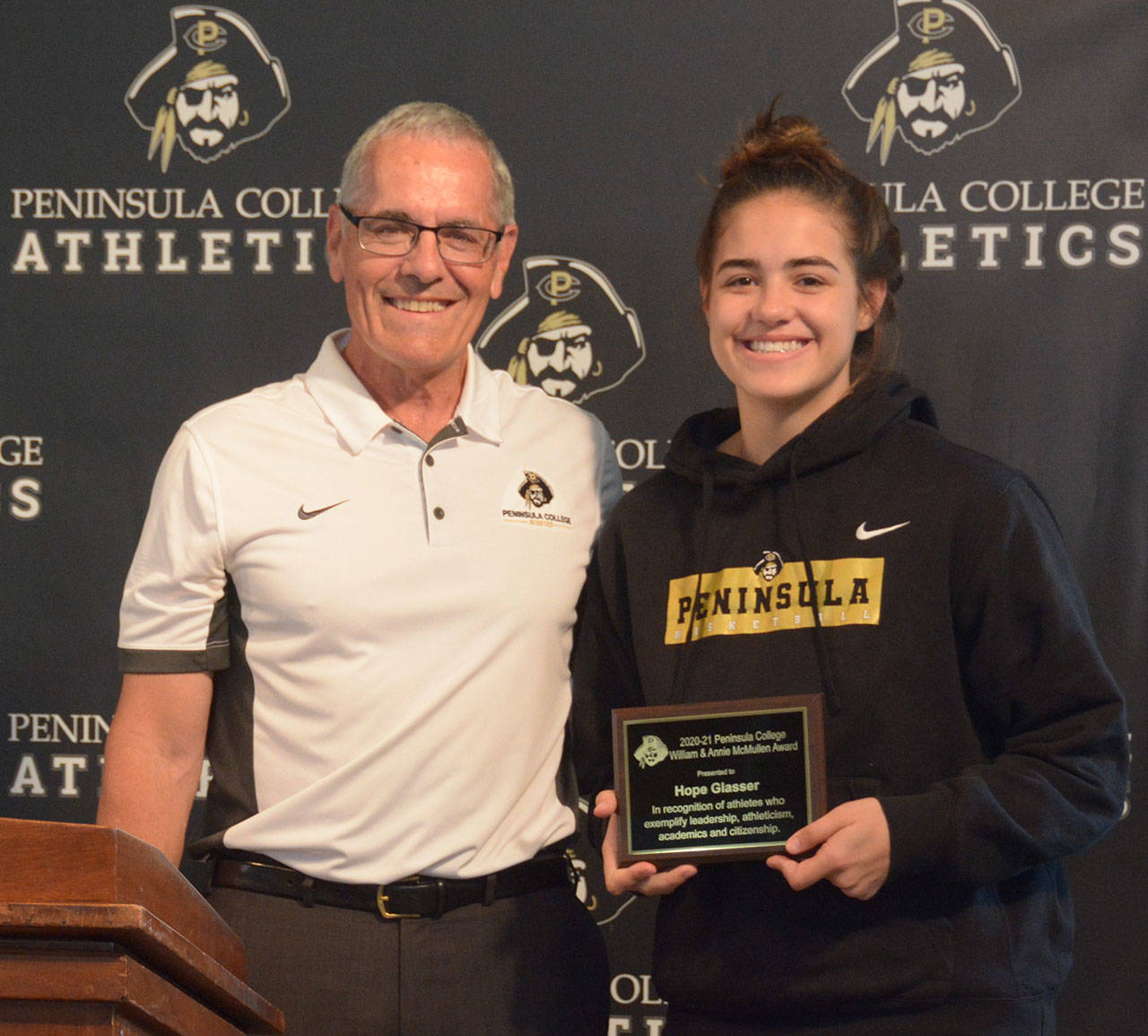 Hope Glasser of Sequim accepts an award heralding efforts by freshmen PC student-athletes from Rick Ross, associate dean of Athletics and Student Life, at an in-person ceremony May 27. Photo curtesy of Peninsula College