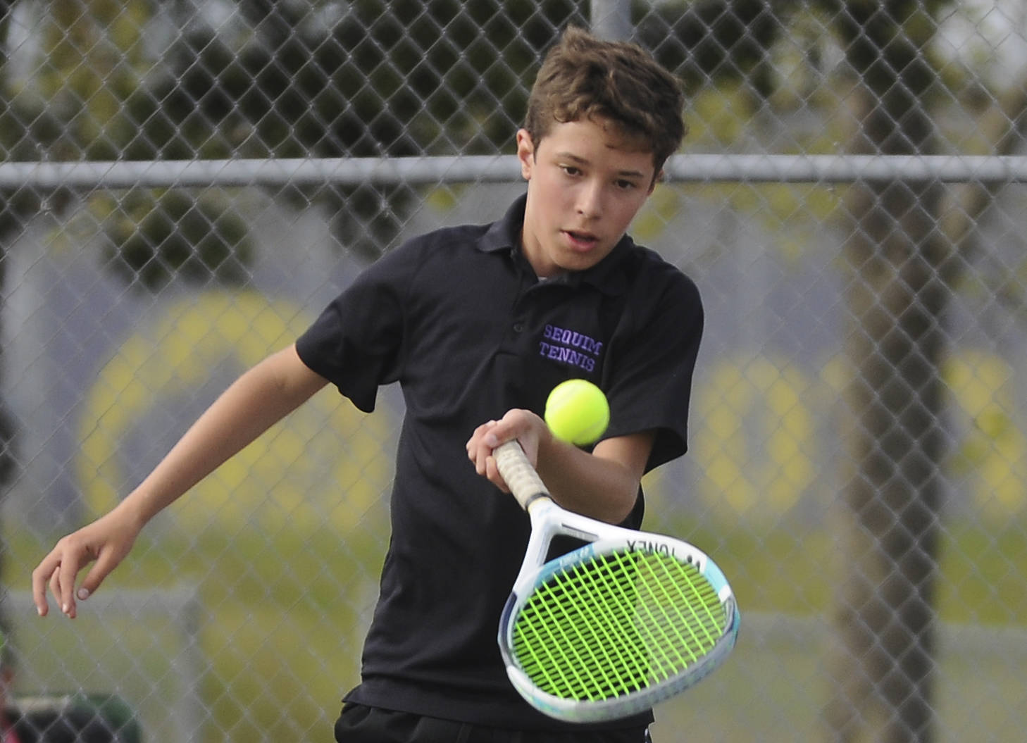 Sequim freshman Garrett Little, pictured here returning a shot against a North Mason foe on May 10, took the Olympic League title last week, going 4-0 in the tourney and 13-0 for the season. Sequim Gazette photo by Michael Dashiell