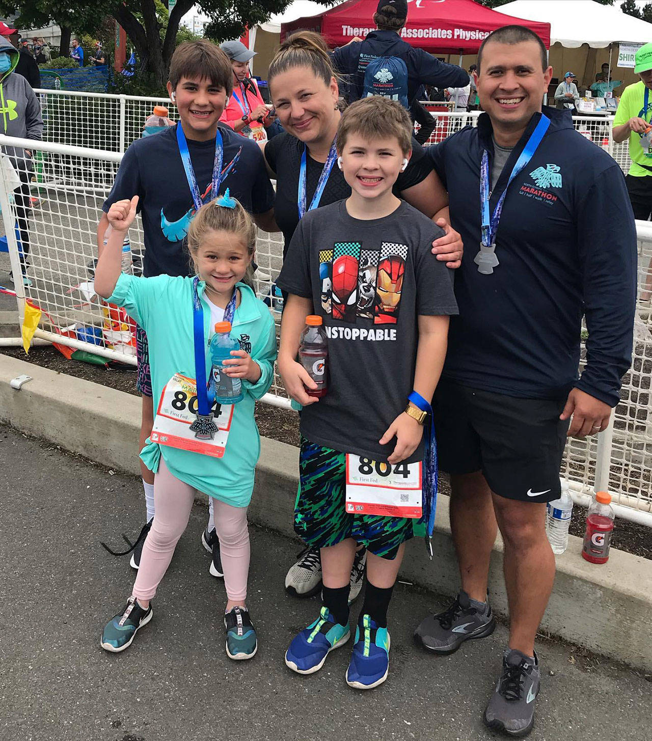 The Laboy family of Sequim celebrates finishing the North Olympic Discovery Marathon after they collaborated to finish the 26.2-mile course as a relay team. Pictured are (back row, from left) Bryant, Mary and Dennis, with (front row) Gabby and Jackson. Photo courtesy of Laboy family