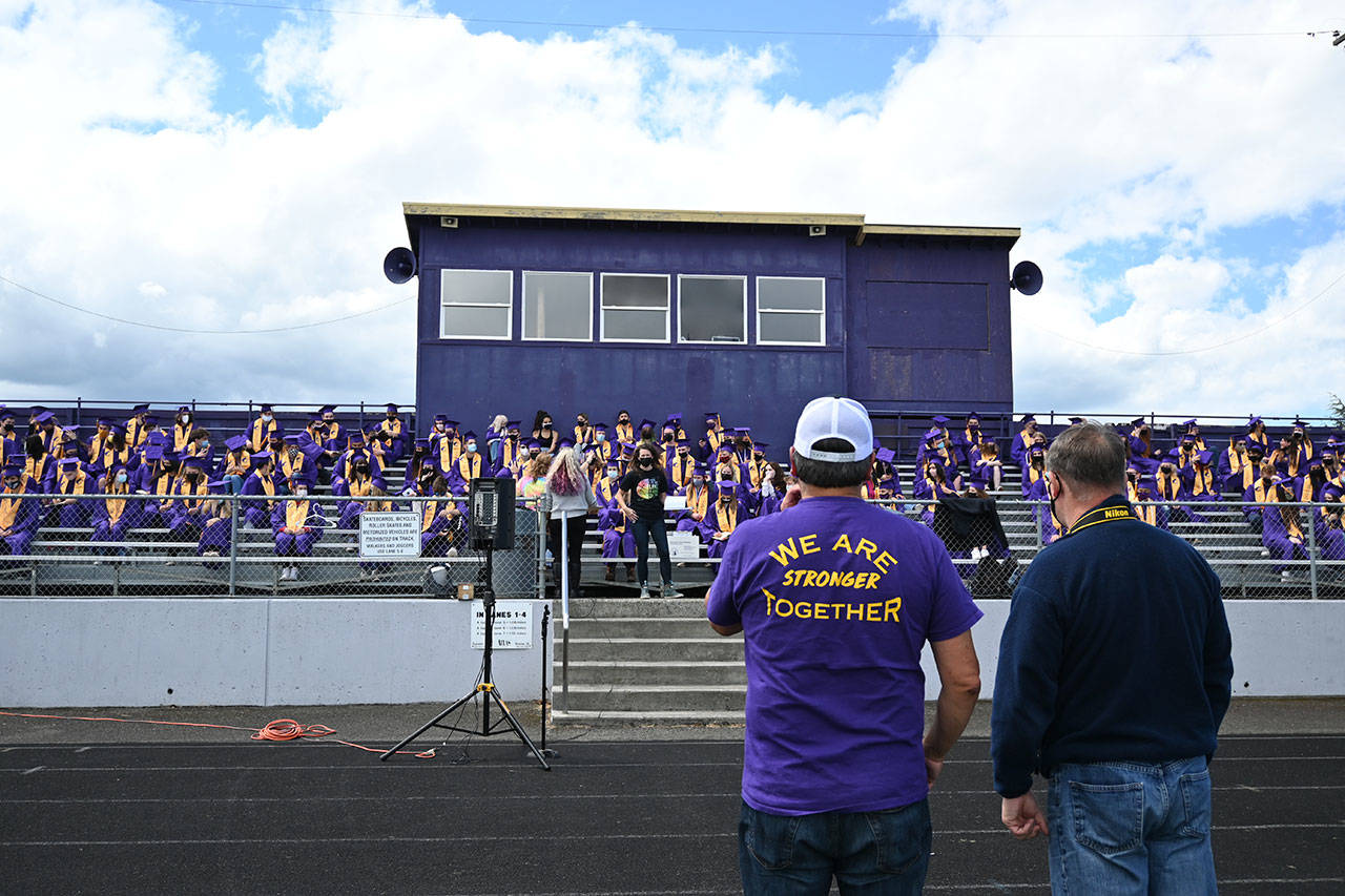 Sequim High School principal Shawn Langston (foreground, left) and photography teacher Jim Heintz look on at an SHS graduation rehearsal on Wednesday, Jan 9. An estimated 187 seniors will graduate at the school’s commencement ceremony on Friday, June 11. Sequim Gazette photo by Michael Dashiell